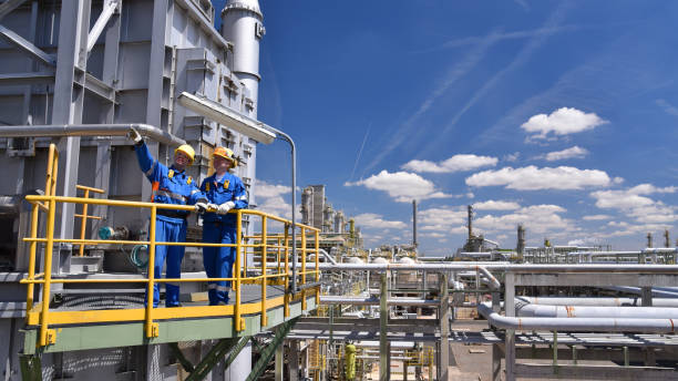Industrial workers on platform with safety equipment